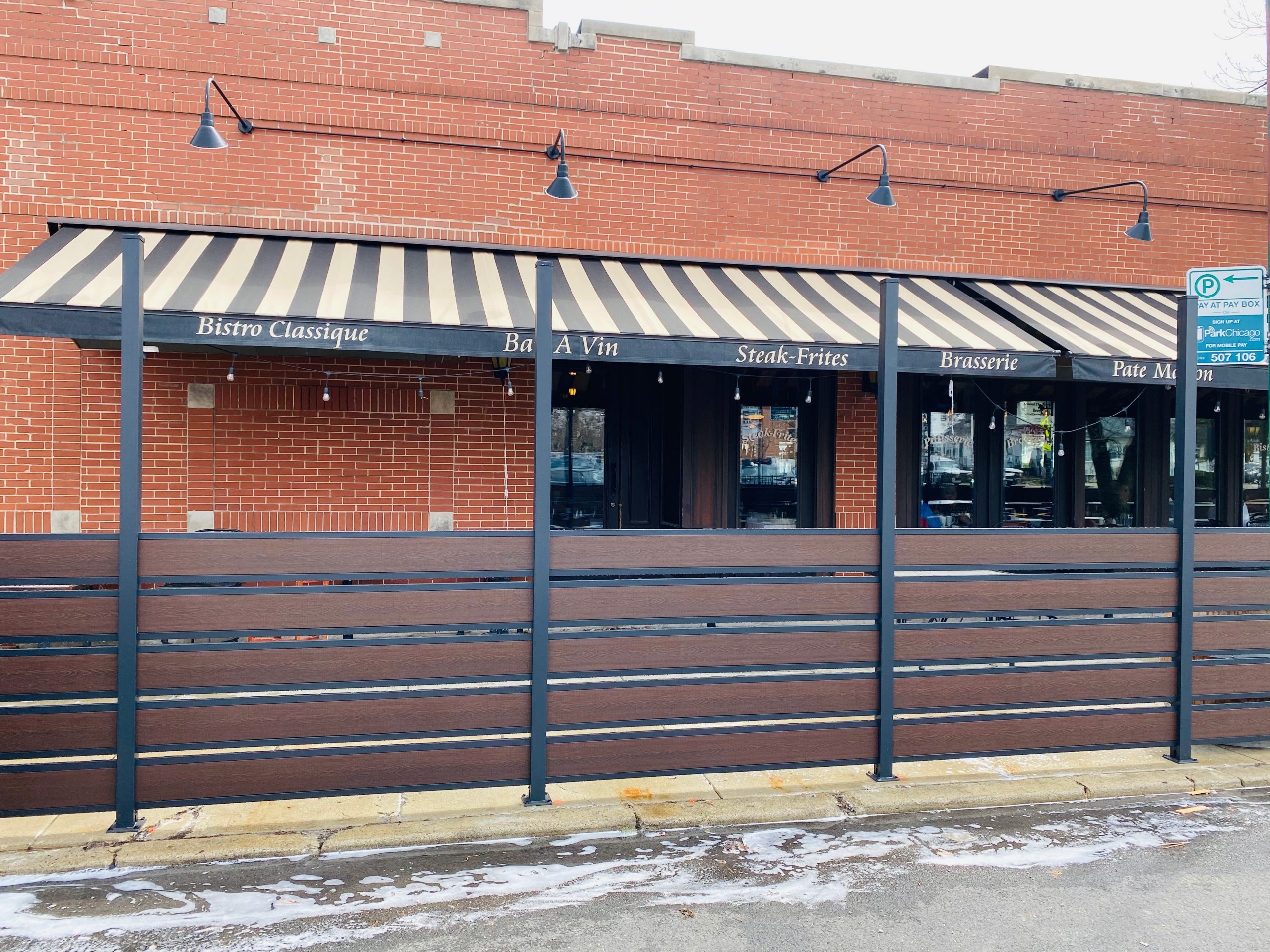 greenwood semi privacy picket fence installed at restaurant patio